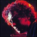 A person with curly hair and red light
Description automatically generated