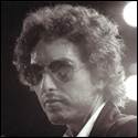 A person with curly hair wearing sunglasses
Description automatically generated