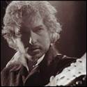 A person with a guitar
Description automatically generated