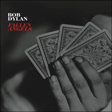 A hand holding playing cards
Description automatically generated