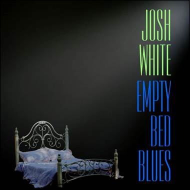 A bed with a blue blanket and a black background
AI-generated content may be incorrect.