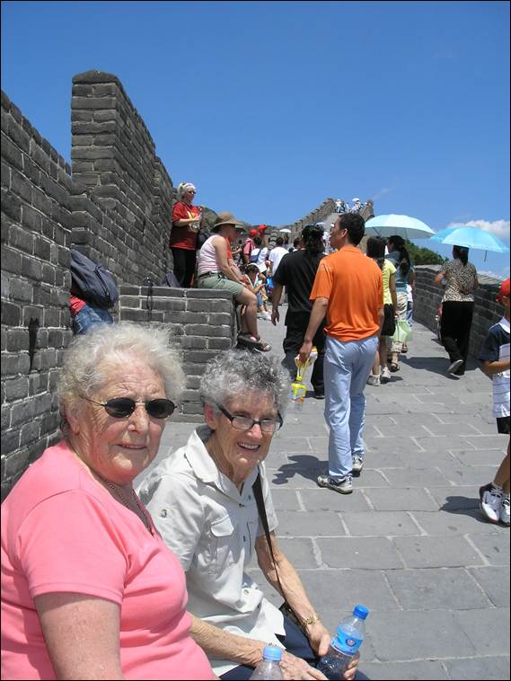 A group of people standing on a stone walkway

AI-generated content may be incorrect.