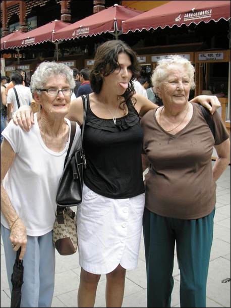 A group of women posing for a photo

AI-generated content may be incorrect.