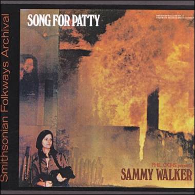 A person standing in front of a fire

Description automatically generated