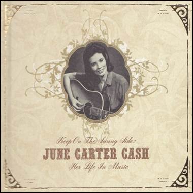 A person holding a guitar

Description automatically generated