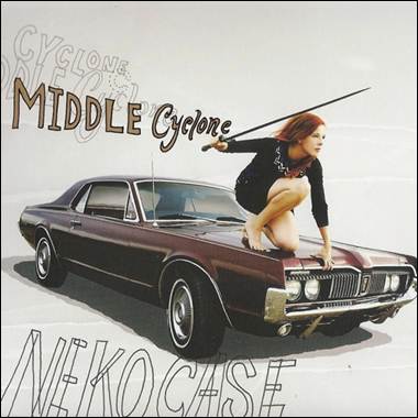 A person holding a sword on a car

Description automatically generated