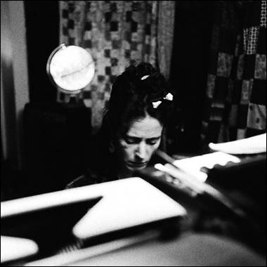 A person sitting at a desk

Description automatically generated