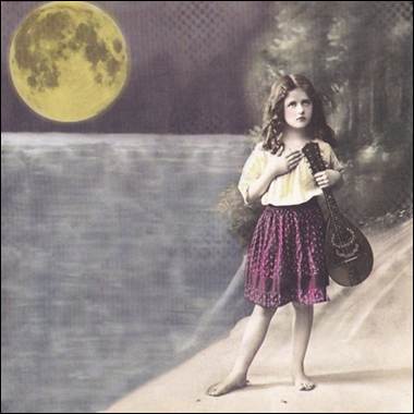 A child holding a guitar

Description automatically generated