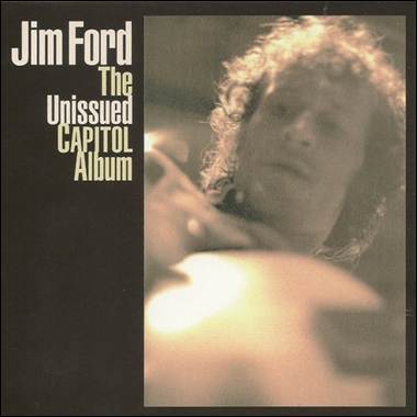 A person with curly hair and a guitar

Description automatically generated