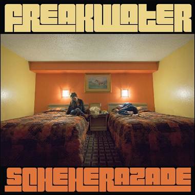 Two people sitting on two beds

Description automatically generated