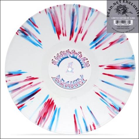 A white disc with red and blue paint

Description automatically generated