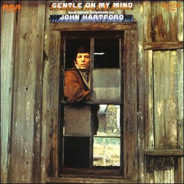 A person looking out a window
Description automatically generated