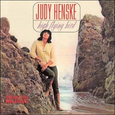 A person sitting on a rock

Description automatically generated