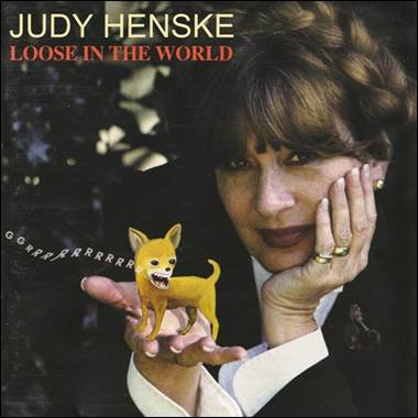 A person holding a small yellow dog

Description automatically generated