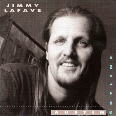 A person with long hair and beard smiling

Description automatically generated