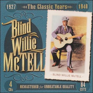 A person sitting on a chair playing a guitar

Description automatically generated