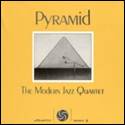 A yellow cover with a picture of a pyramid

Description automatically generated