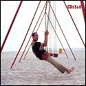 A person on a swing on a beach

AI-generated content may be incorrect.