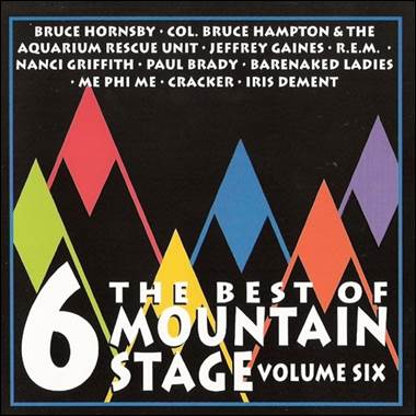 A cd cover with colorful mountains and white text

Description automatically generated