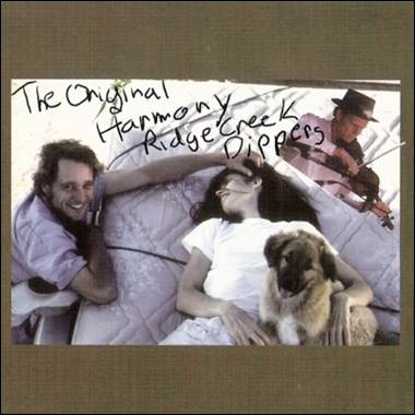 A group of people lying in bed with a dog and a violin

Description automatically generated