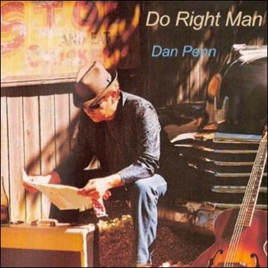 A person sitting on a bench reading a newspaper

Description automatically generated