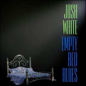 A bed with a blue blanket and a black background
AI-generated content may be incorrect.