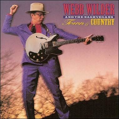 A person in a purple suit and hat playing a guitar

Description automatically generated