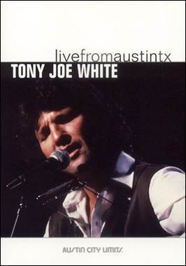 A person singing into a microphone
Description automatically generated