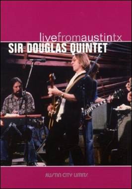 A person playing guitar on a stage
Description automatically generated