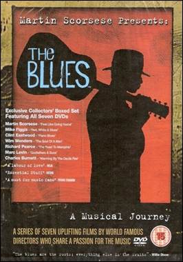 A person holding a guitar
Description automatically generated