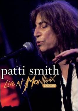 A person singing into a microphone
Description automatically generated