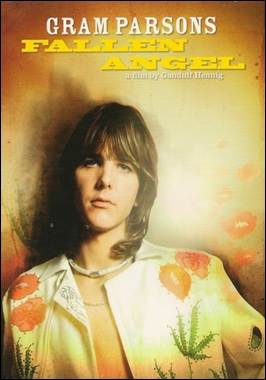 A person with long hair wearing a white shirt
Description automatically generated