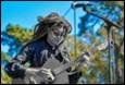 A person playing a guitar

Description automatically generated with medium confidence