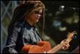 A person playing a guitar

Description automatically generated with medium confidence