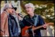 A group of men playing guitar and singing

Description automatically generated with low confidence