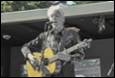 A person playing a guitar

Description automatically generated with medium confidence