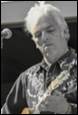 A person playing a guitar

Description automatically generated with medium confidence