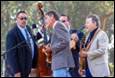 A group of men playing instruments

Description automatically generated with medium confidence