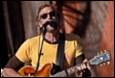 A person playing guitar and singing

Description automatically generated with low confidence