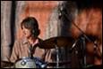 A person playing a drum set

Description automatically generated with medium confidence