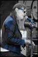 A person singing into a microphone

Description automatically generated with medium confidence