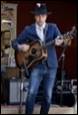 A person playing a guitar

Description automatically generated with medium confidence