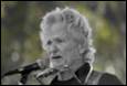 A picture containing person, microphone, outdoor, concert

Description automatically generated
