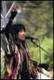 A picture containing microphone, clothing, person, concert

Description automatically generated