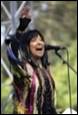 A person singing into a microphone

Description automatically generated with medium confidence