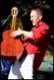 A person playing a guitar

Description automatically generated with medium confidence