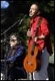 A picture containing clothing, musical instrument, person, music

Description automatically generated