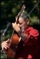 A person playing a guitar

Description automatically generated
