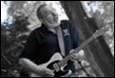 A person playing a guitar

Description automatically generated with medium confidence