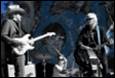 A group of people playing instruments

Description automatically generated with medium confidence